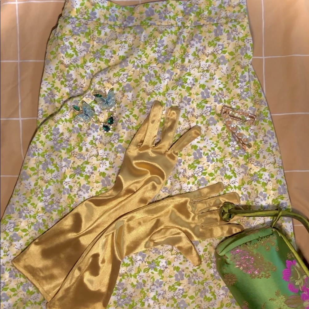 Green knee-length floral cottagecore skirt.